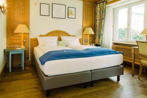 Postel nebo postele na pokoji v ubytování Boutique Hotel SEITNER HOF München Pullach