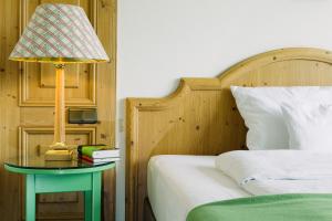 Postel nebo postele na pokoji v ubytování Boutique Hotel SEITNER HOF München Pullach
