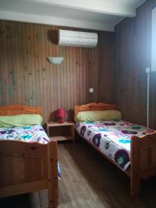 Ein Bett oder Betten in einem Zimmer der Unterkunft Maison Valras accès direct à la plage