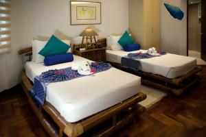 Postel nebo postele na pokoji v ubytování 357 Boracay Resort