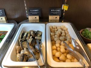 two trays of food on display in a store at Super Hotel JR Ikebukuro Nishiguchi in Tokyo