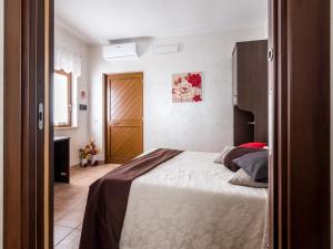 Postel nebo postele na pokoji v ubytování La casetta di richetto