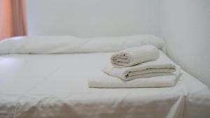 Postel nebo postele na pokoji v ubytování Hostal Bocanegra