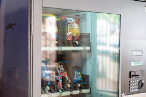 a vending machine with drinks and snacks in it at Hostal Bocanegra in Granada