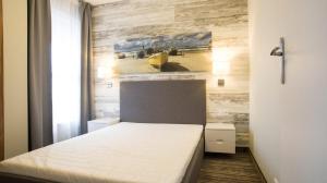 Posteľ alebo postele v izbe v ubytovaní Apartamenty Krynica No.1