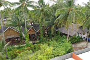 an aerial view of a resort with palm trees at Latitude 10 Siargao in General Luna