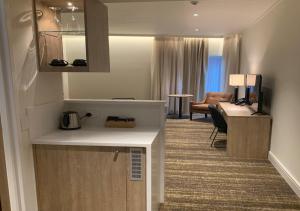 Postel nebo postele na pokoji v ubytování Porter's Plainland Hotel