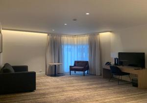 TV a/nebo společenská místnost v ubytování Porter's Plainland Hotel