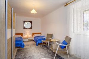 Posteľ alebo postele v izbe v ubytovaní Apartments Ivna