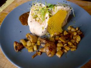 a blue plate of food with potatoes and meat at LE MOULIN DE BOULÈDE in Monflanquin