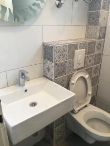a bathroom with a sink and a toilet at Apartment Marevista in Zaostrog