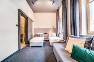 Posteľ alebo postele v izbe v ubytovaní GoldApartRooms