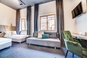 Posteľ alebo postele v izbe v ubytovaní GoldApartRooms