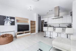 A kitchen or kitchenette at Luxury Beach Front Apartment with Pool