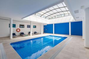 The swimming pool at or close to Luxury Beach Front Apartment with Pool
