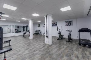 The fitness centre and/or fitness facilities at Luxury Beach Front Apartment with Pool