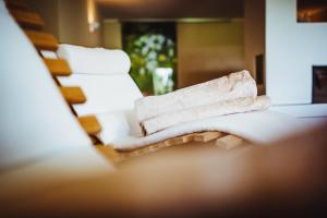 Postel nebo postele na pokoji v ubytování Gourmet - Boutique Hotel Tanzer