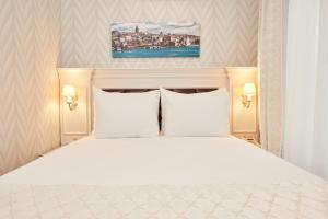 Ein Bett oder Betten in einem Zimmer der Unterkunft Albinas Hotel Old City