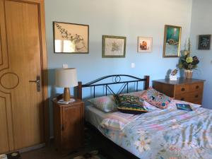 מיטה או מיטות בחדר ב-Karpathos Guest House