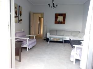 A bed or beds in a room at Luca Apartments