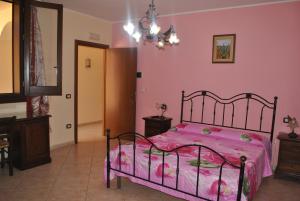 Ένα ή περισσότερα κρεβάτια σε δωμάτιο στο B&B Ippocampo