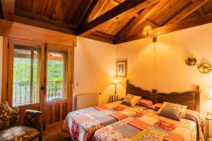 a bedroom with a bed in a room with wooden ceilings at Casa El Herragu in El Arenal