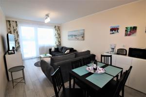 Część wypoczynkowa w obiekcie Apartament Superior Pastelowy Przy Plaży