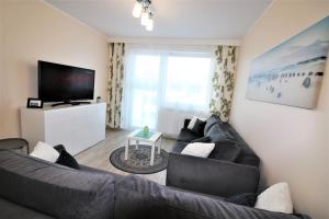 Telewizja i/lub zestaw kina domowego w obiekcie Apartament Superior Pastelowy Przy Plaży