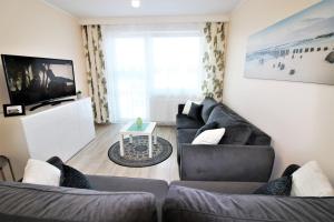 Część wypoczynkowa w obiekcie Apartament Superior Pastelowy Przy Plaży