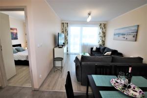 Łóżko lub łóżka w pokoju w obiekcie Apartament Superior Pastelowy Przy Plaży