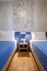 Posteľ alebo postele v izbe v ubytovaní OURANOUPOLI BUNGALOWS & CAMPING