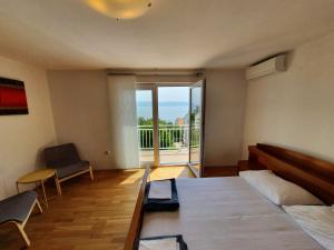 Postel nebo postele na pokoji v ubytování Apartment Bella Mare