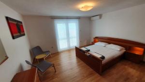 Postel nebo postele na pokoji v ubytování Apartment Bella Mare