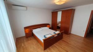 Postel nebo postele na pokoji v ubytování Apartment Bella Mare