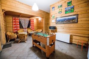 a game room with a foosball table and chairs at Willa pod Jodłą in Poronin