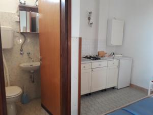 a small bathroom with a sink and a toilet at Apartmani Ana Novi V. - studio in Novi Vinodolski +54 photos