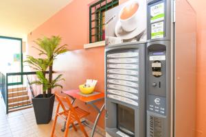 a large vending machine with a hat on top of it at Residence Parco in Sirmione