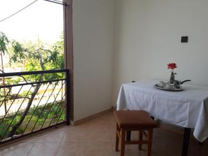 a table in a room with a view of a balcony at Apartmani Ana Novi V. - studio in Novi Vinodolski