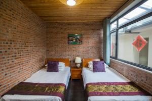 Beijing Mutianyu Great Wall Wangshanyuan Homestay客房内的一张或多张床位