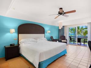 a bedroom with a large bed and a large window at Barceló Bávaro Beach - Adults Only All Inclusive in Punta Cana