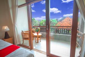 Postel nebo postele na pokoji v ubytování Satya House Ubud