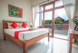 Postel nebo postele na pokoji v ubytování Satya House Ubud