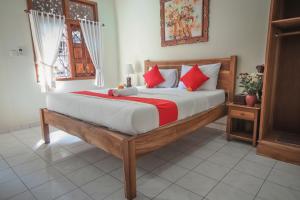 Postel nebo postele na pokoji v ubytování Satya House Ubud