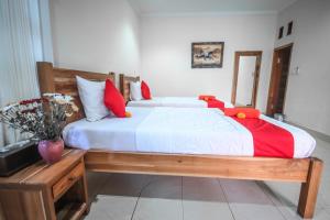 Postel nebo postele na pokoji v ubytování Satya House Ubud