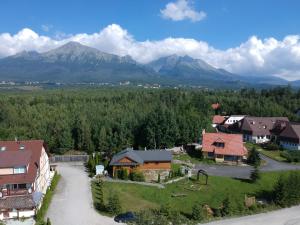 an aerial view of a village with mountains in the background at Apartment Eric,High Tatras in Dolný Smokovec