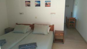Postel nebo postele na pokoji v ubytování Theo Apartments