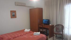 Postel nebo postele na pokoji v ubytování Hotel Svizzero