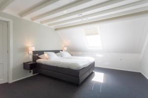 Un pat sau paturi într-o cameră la B&B de Lijsterhof