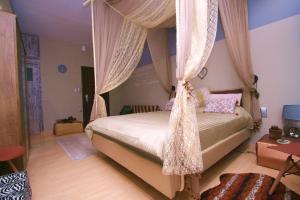 A bed or beds in a room at Flying Bed Ioannina in the center of the city
