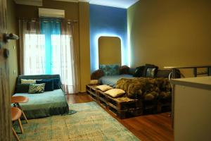 A bed or beds in a room at Flying Bed Ioannina in the center of the city